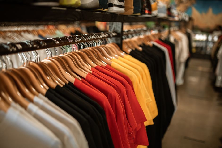 Clothes neatly hanging on a wardrobe rack